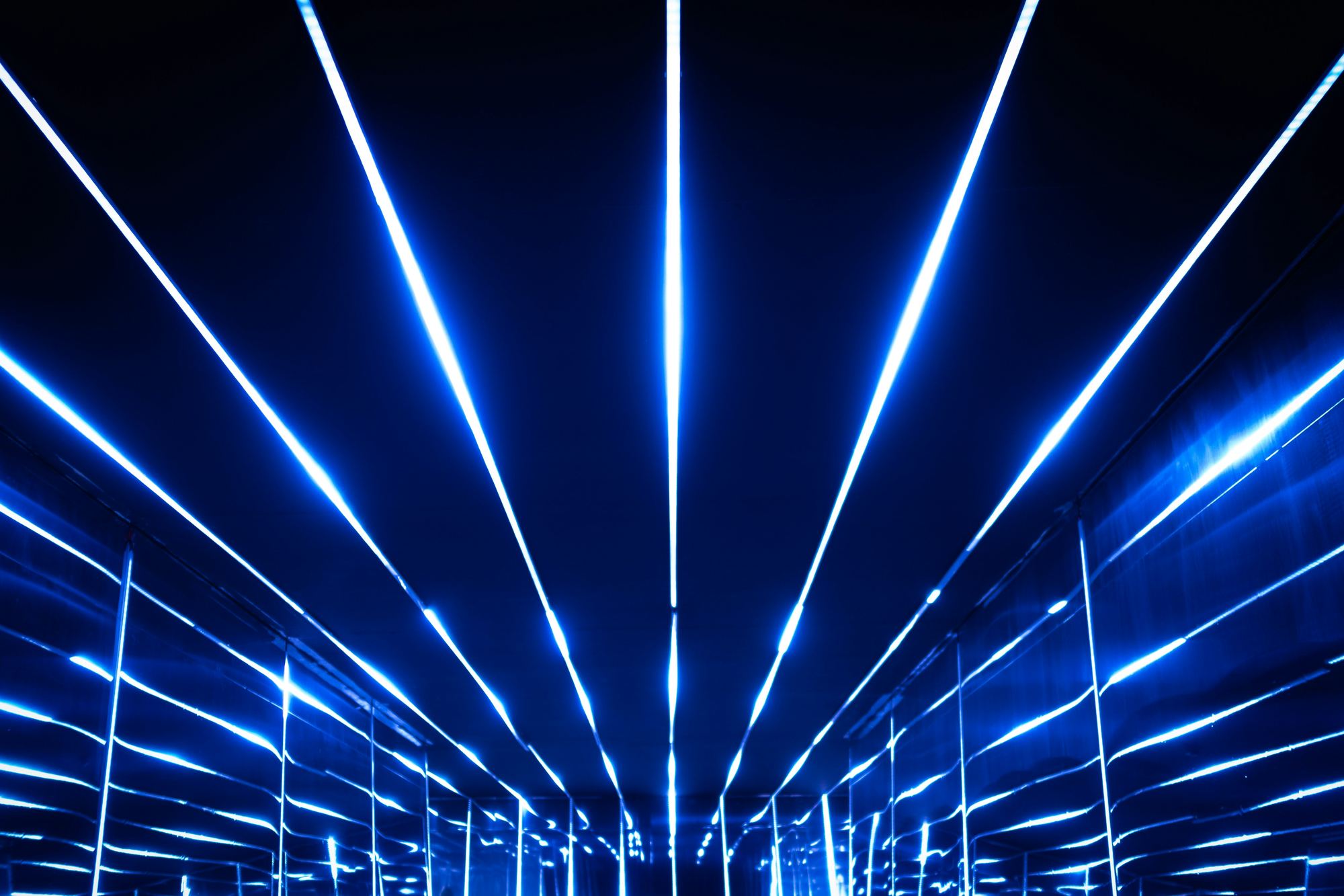 Abstract lines of light converging, like signal patterns in data